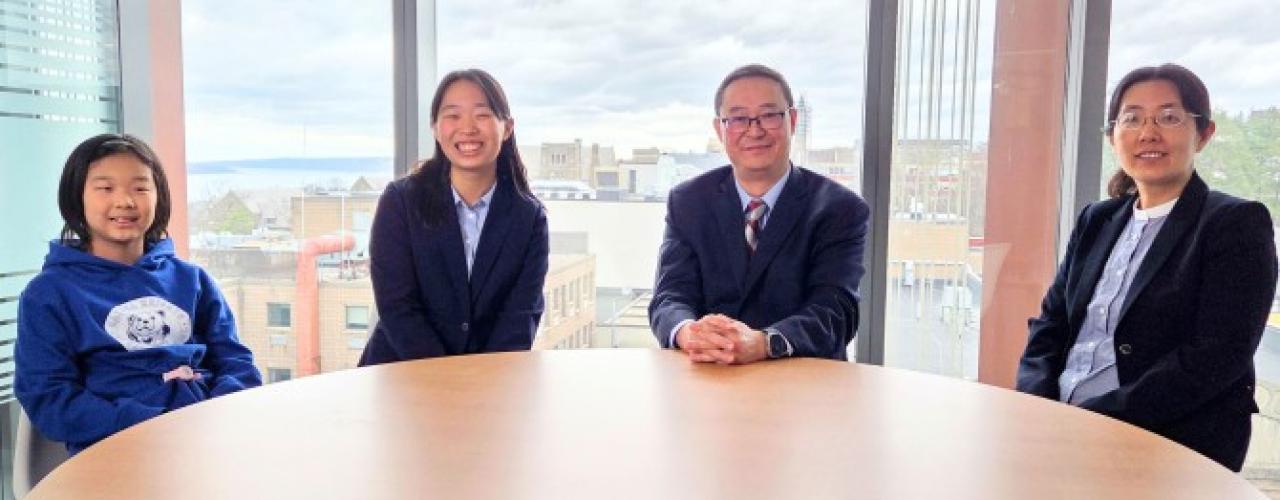 From left are Christine and Cornelia Ye, the namesakes of the new Ye Awards, and their parents, Mao Ye and Xi Yang, Cornell faculty and alumni.