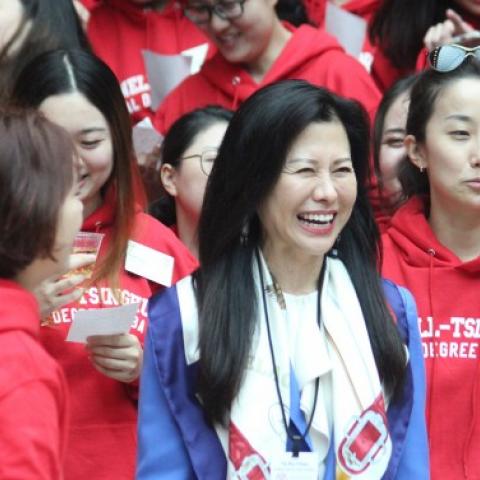 Ya-Ru Chen, dean for China Initiatives at the Cornell SC Johnson College of Business, shares a laugh with Chinese students at a welcoming event for participants in the Cornell-Tsinghua dual MBA program on Sept. 27.